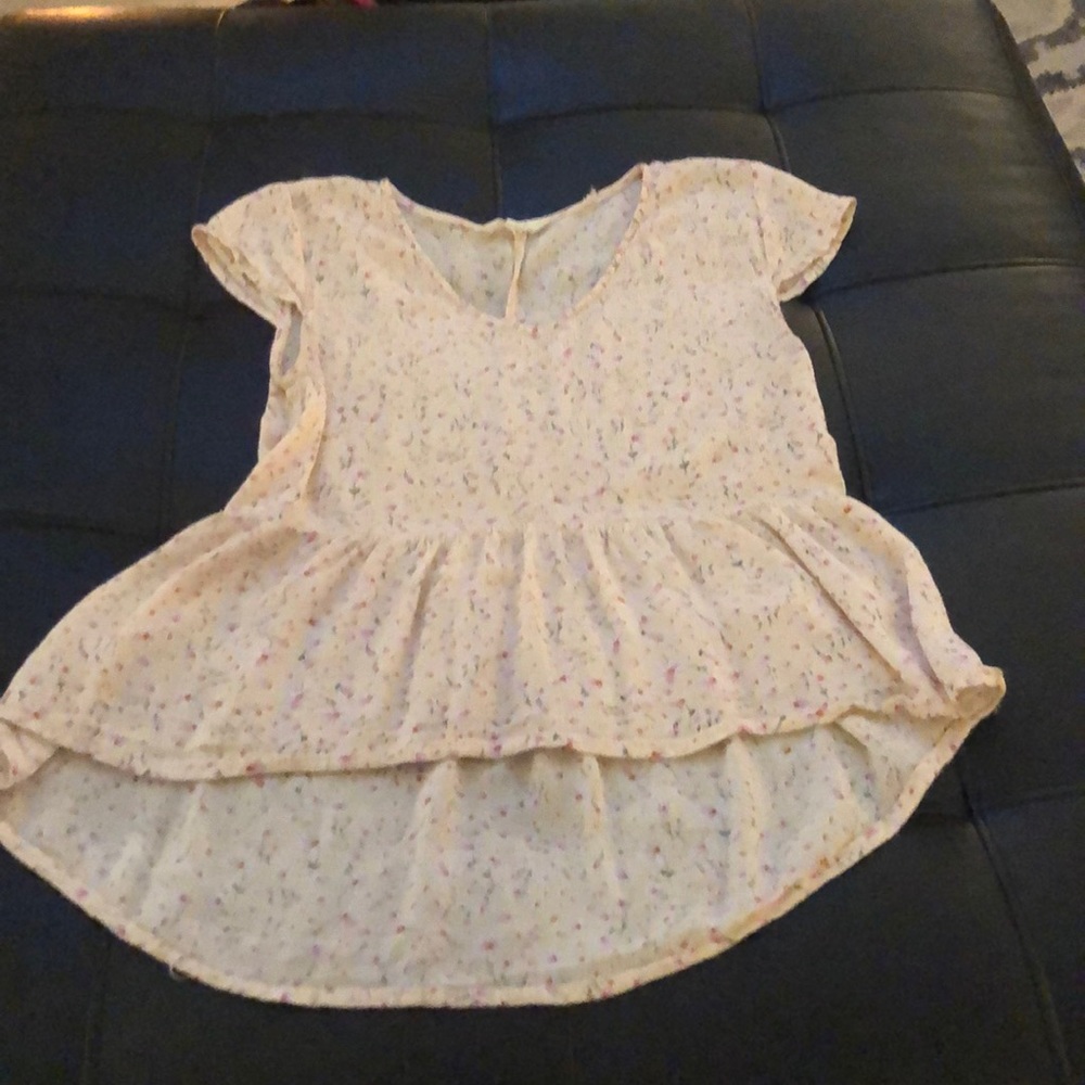 light pink blouse with flowers on it